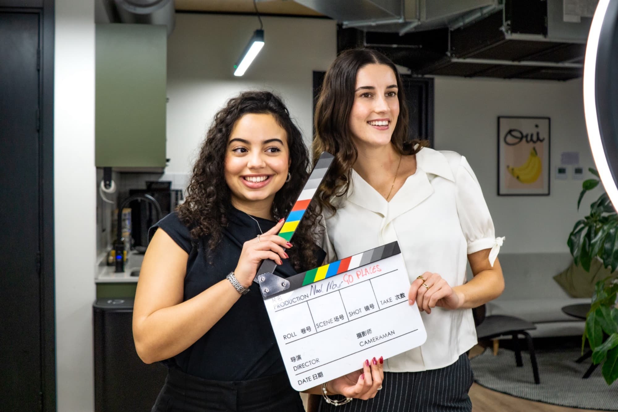 GoPlaces creators on set with a clapperboard